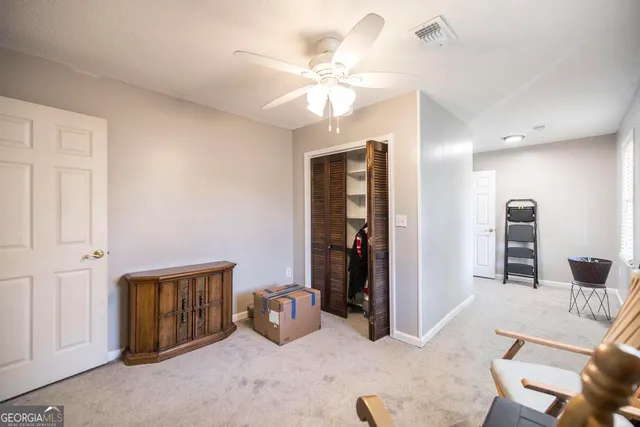 a view of a livingroom with a workspace