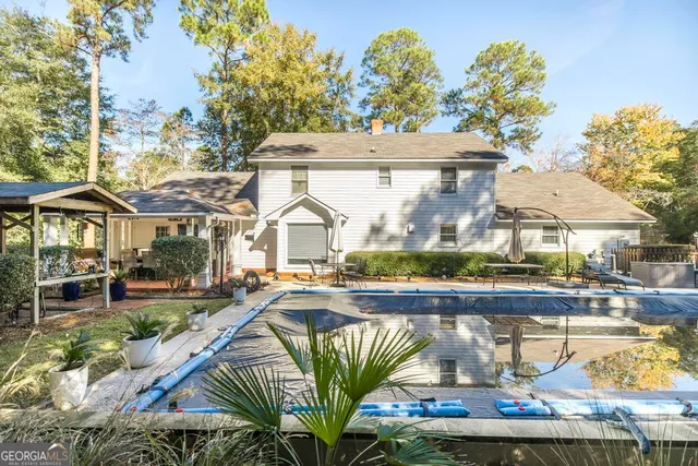 a view of multiple houses with a swimming pool