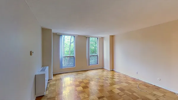 a view of an empty room with a window