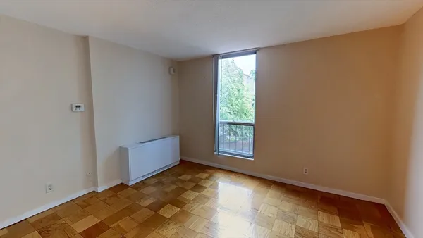 a view of an empty room with a window
