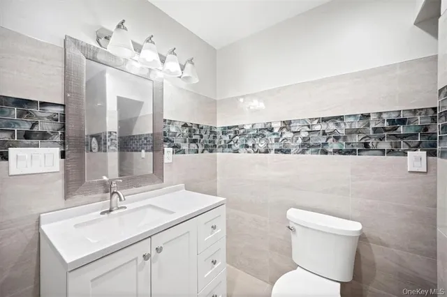 a bathroom with a toilet a sink and bathtub