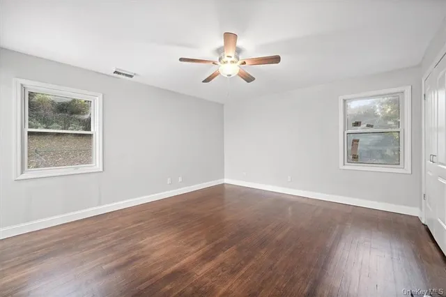 a bathroom with a toilet and shower