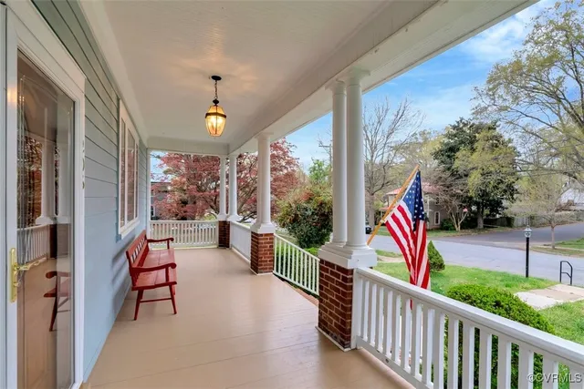 a view of two chairs and tables in the balcony