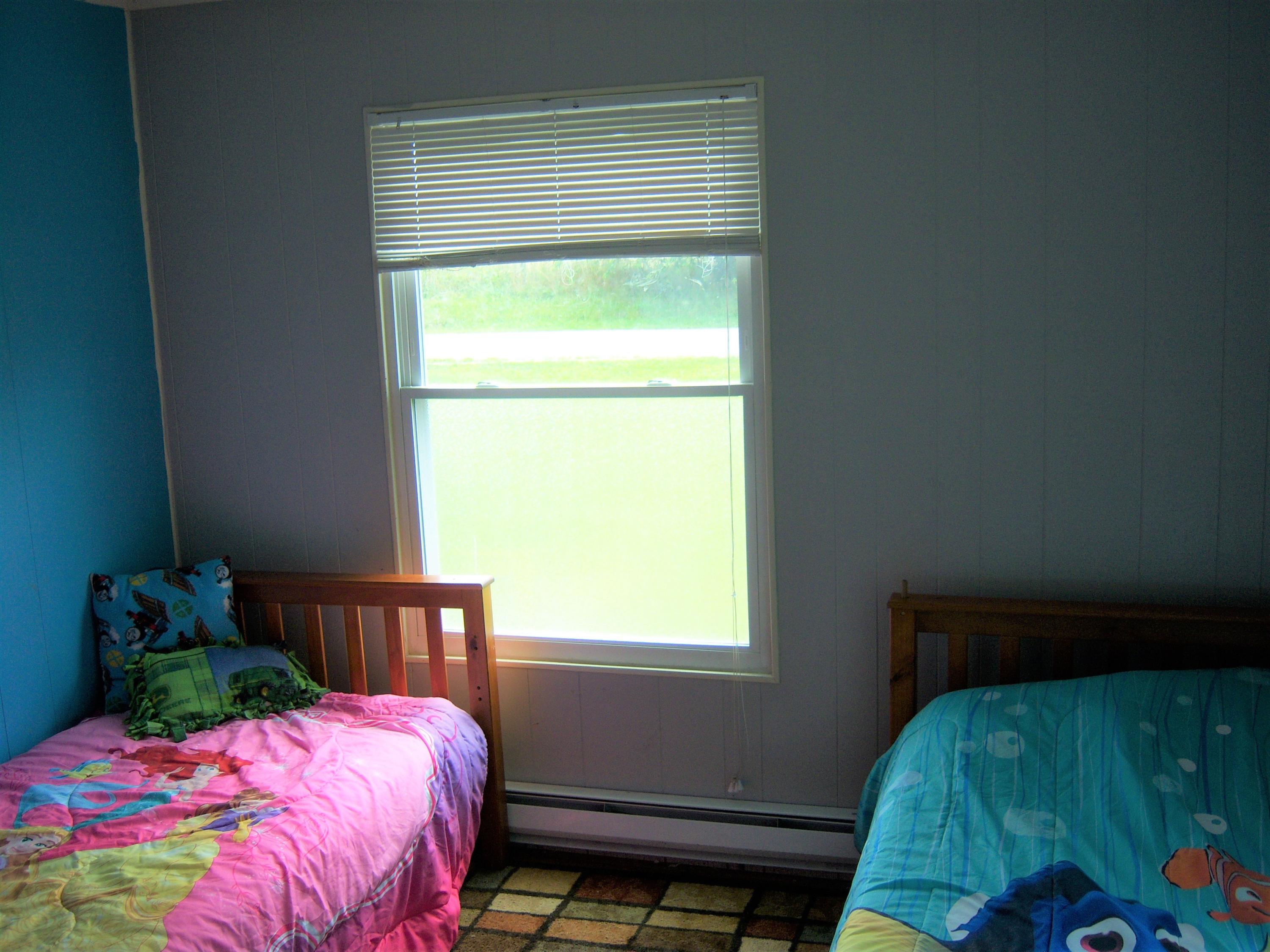 6779 Conner Road Northeast Copper Hill, VA 24079 - Photo 11 of 18 a bedroom with a bed and a window