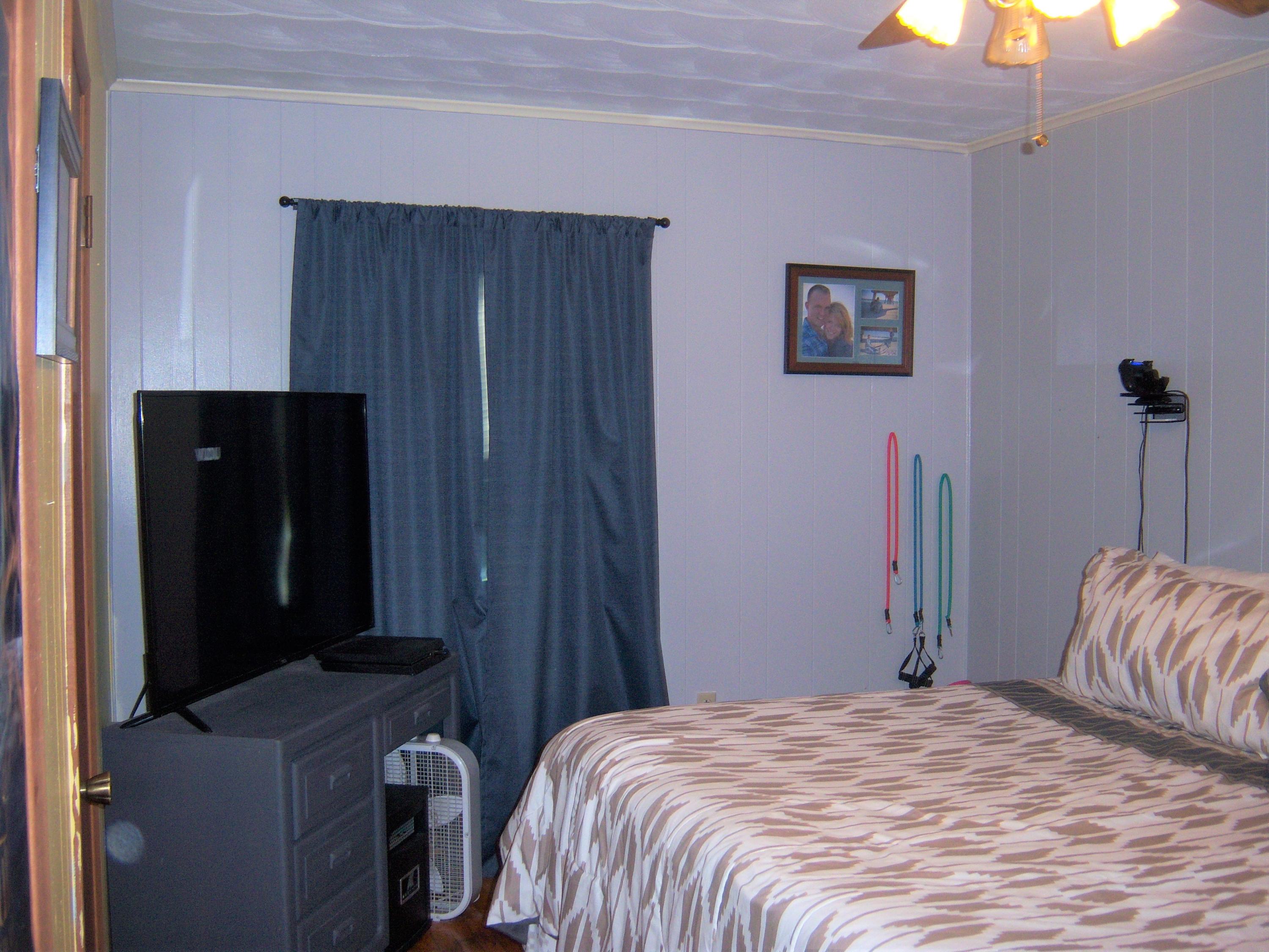 6779 Conner Road Northeast Copper Hill, VA 24079 - Photo 12 of 18 a bedroom with a bed and a mirror