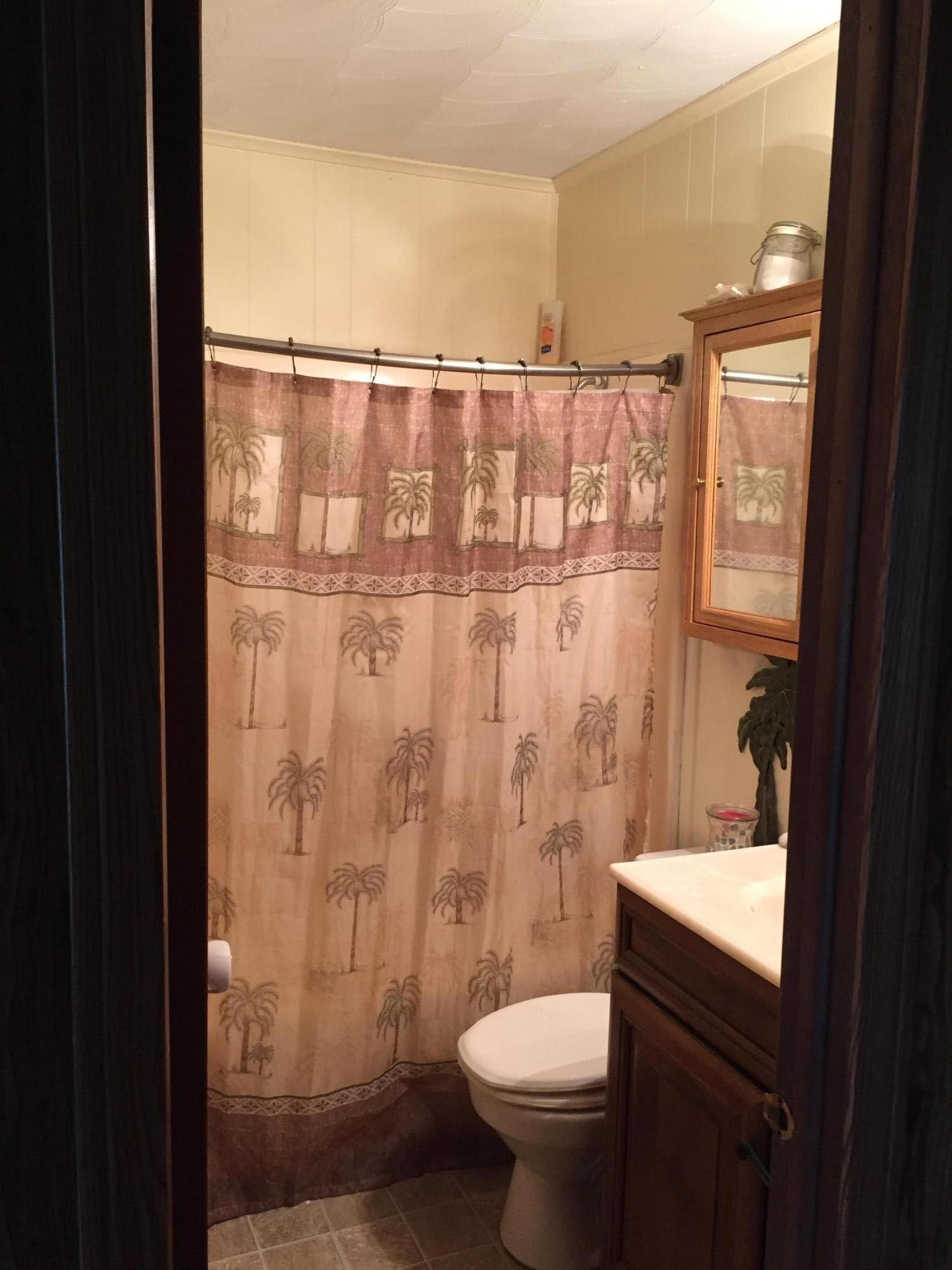 6779 Conner Road Northeast Copper Hill, VA 24079 - Photo 13 of 18 a bathroom with a sink toilet and shower