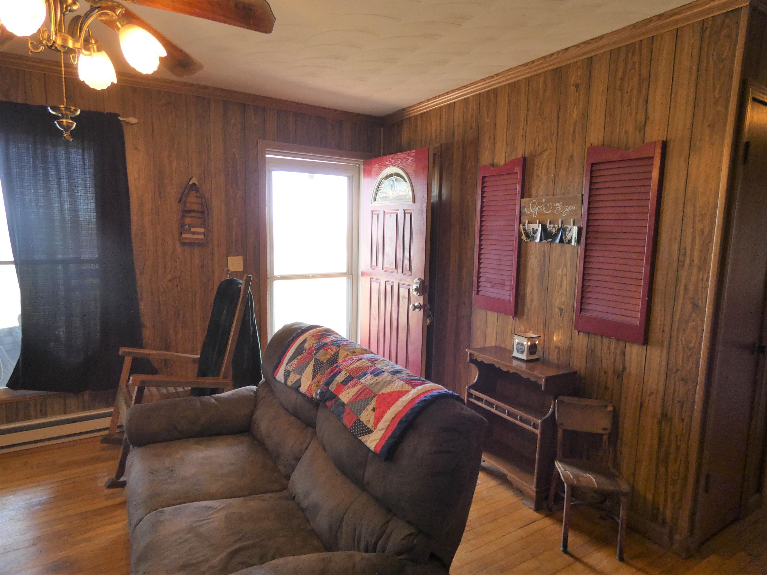6779 Conner Road Northeast Copper Hill, VA 24079 - Photo 14 of 18 a living room with furniture and a window