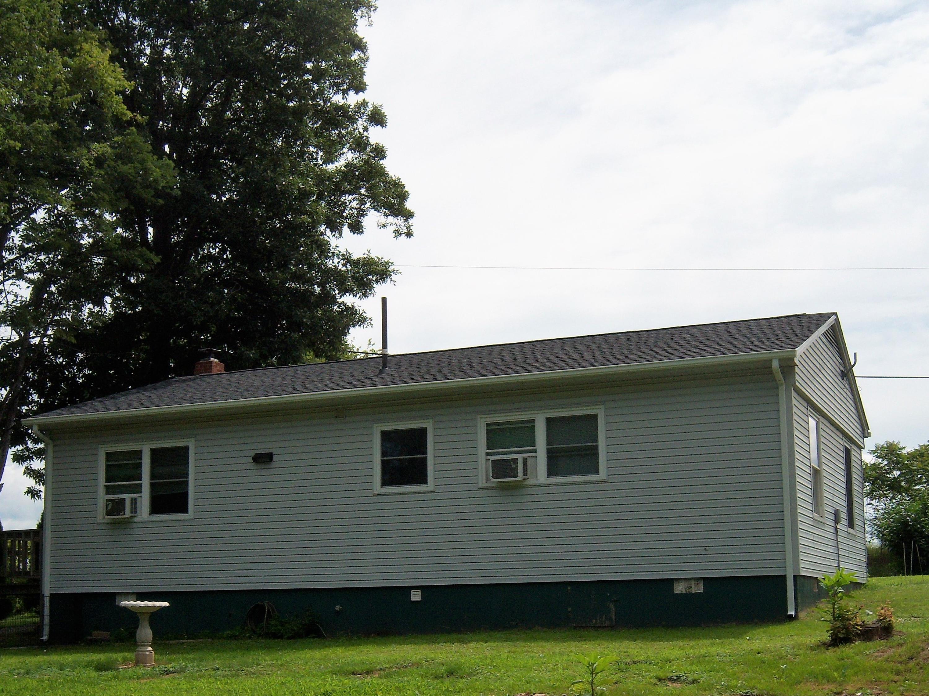 6779 Conner Road Northeast Copper Hill, VA 24079 - Photo 18 of 18 a front view of a house with garden