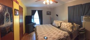 6779 Conner Road Northeast Copper Hill, VA 24079 - Photo 10 of 18 a bedroom with a bed and a chandelier