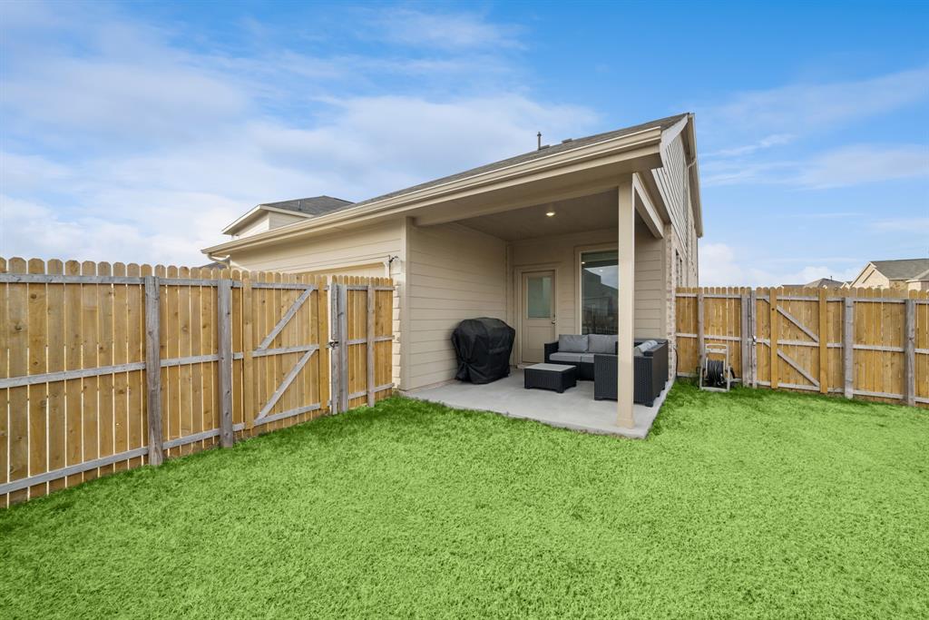 10040 Thornapple Road Fort Worth, TX 76179 - Photo 21 of 24 a backyard of a house with table and chairs