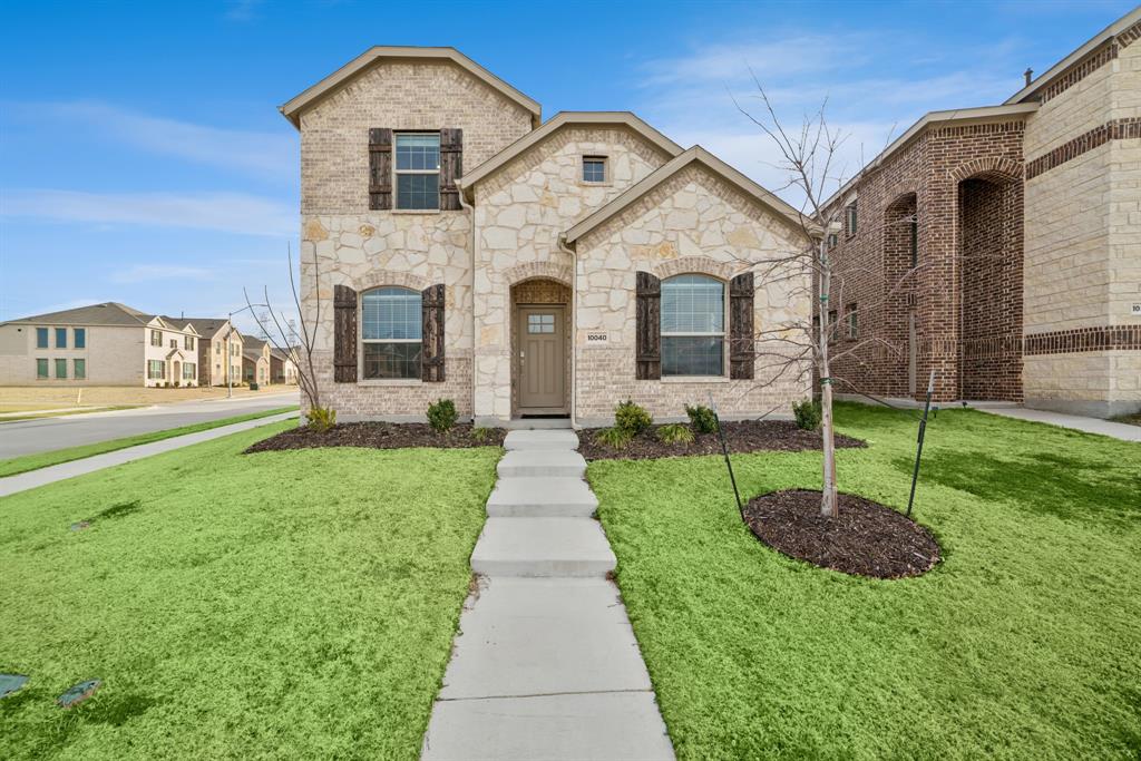 10040 Thornapple Road Fort Worth, TX 76179 - Photo 4 of 24 a front view of a house with a yard and fence
