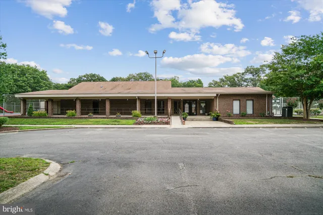 a front view of house with yard outdoor seating and barbeque oven