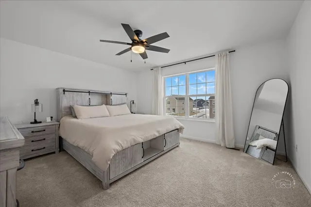 a bed room with a bed and a window