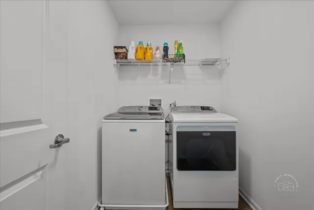 a utility room with dryer and washer