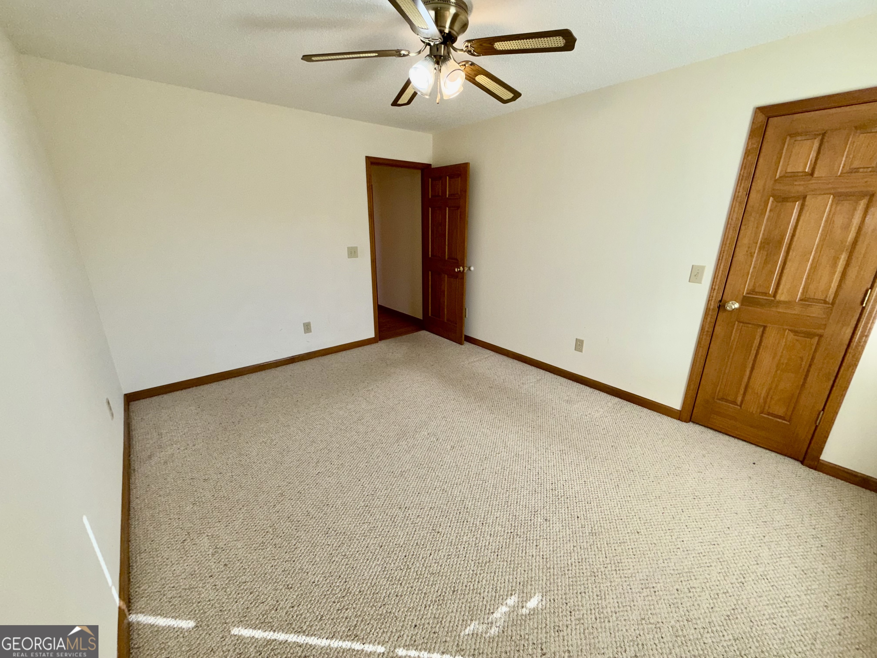 494 Broad Street Bowman, GA 30624 - Photo 46 of 65 a view of a room with a ceiling fan