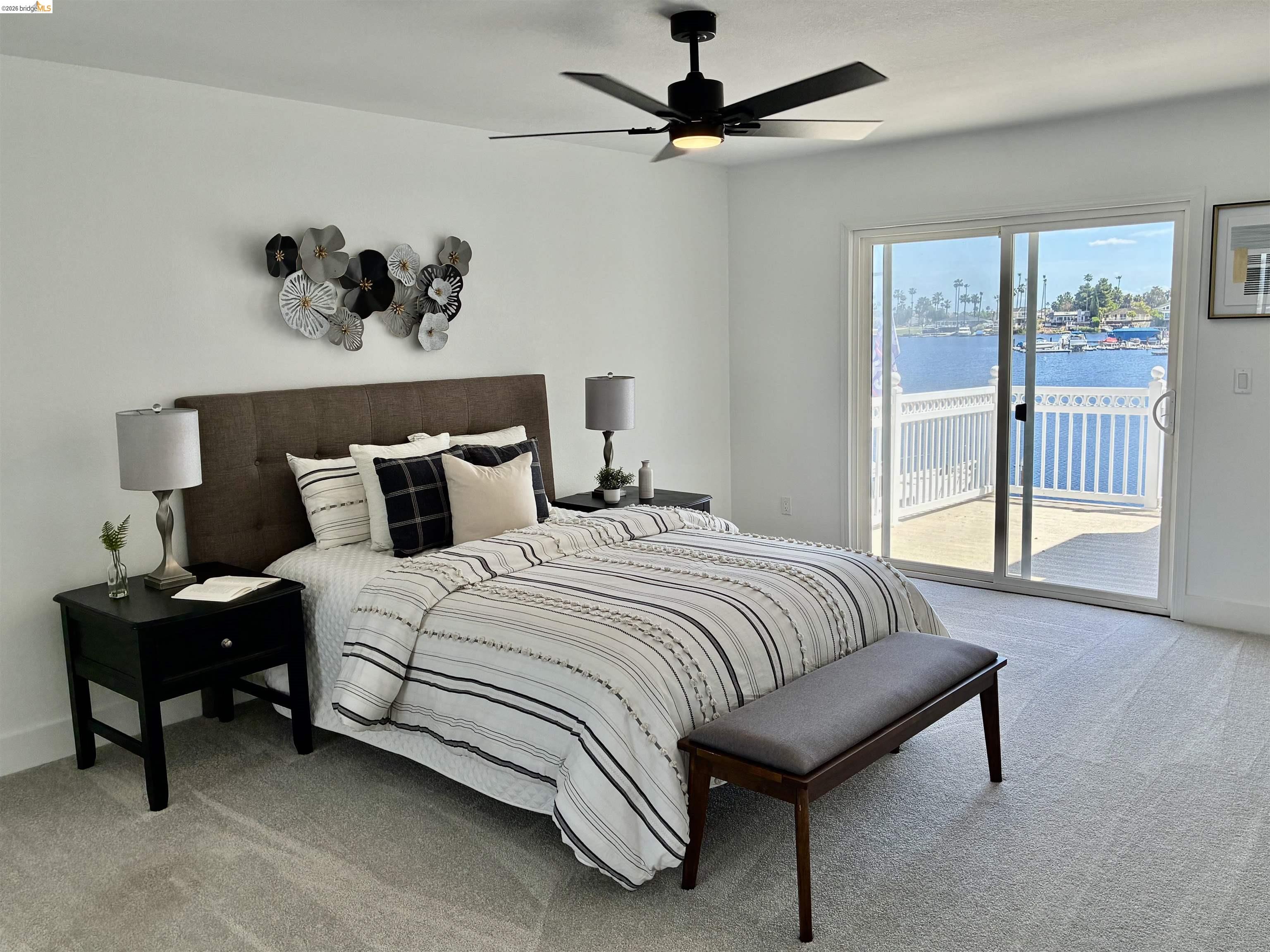 4741 Discovery Point Discovery Bay, CA 94505 - Photo 29 of 52 a bedroom with a bed and a painting on the wall