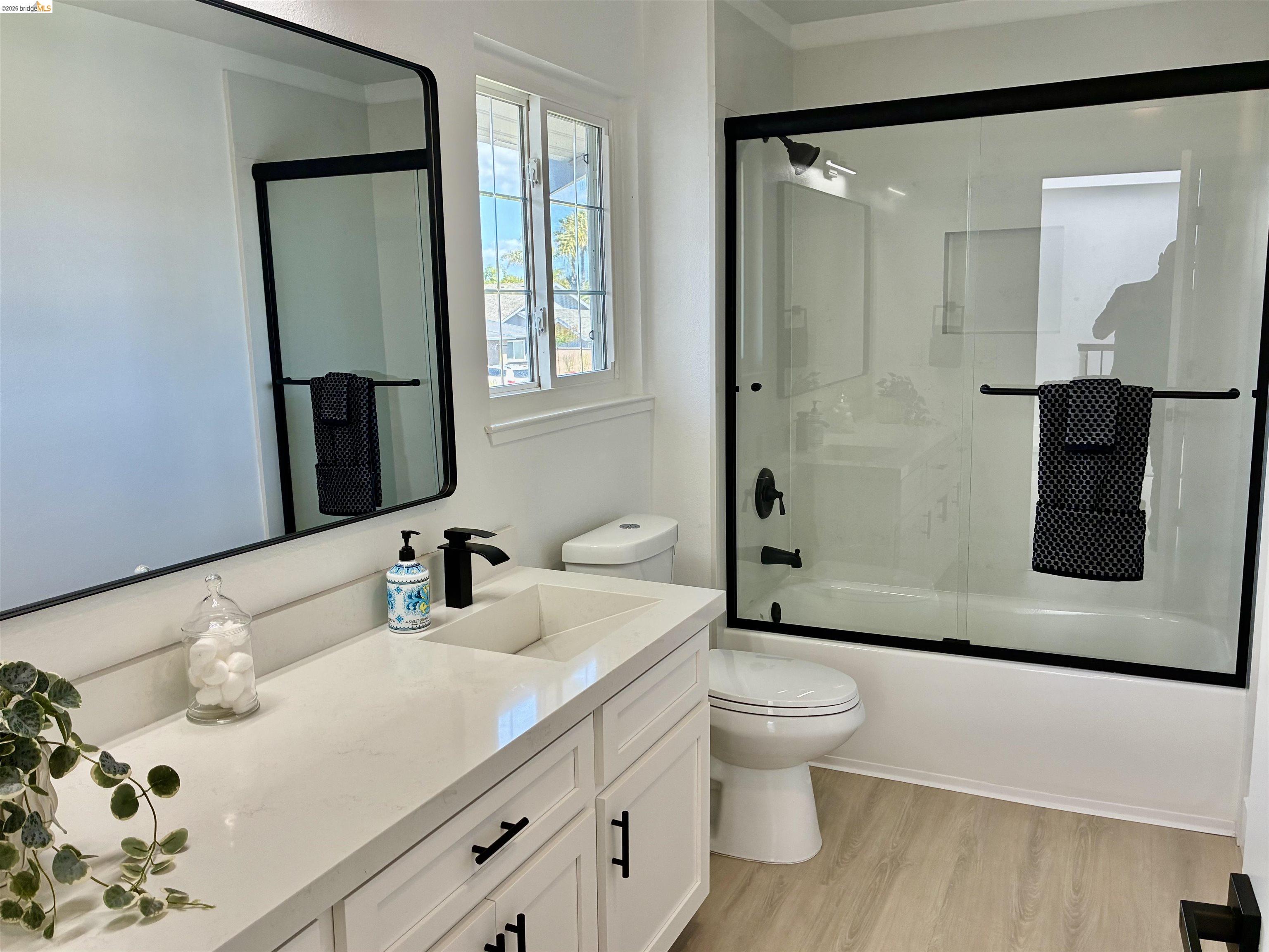4741 Discovery Point Discovery Bay, CA 94505 - Photo 35 of 52 a bathroom with a double vanity sink toilet and shower