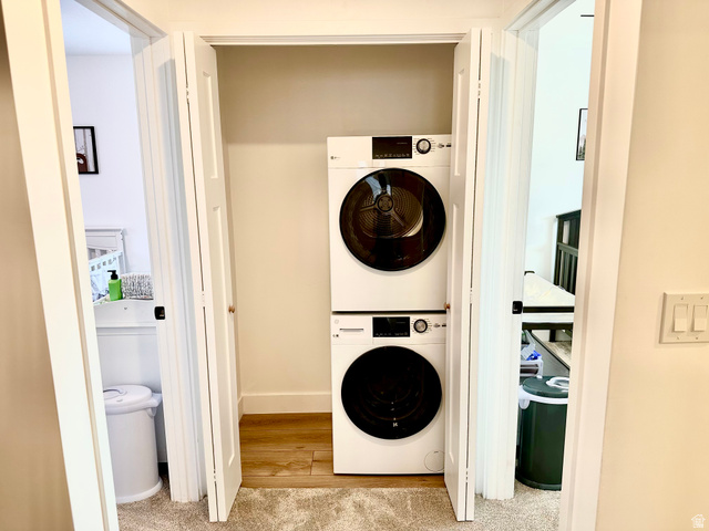 7818 North Windhover Road Eagle Mountain, UT 84005 - Photo 22 of 32 Integrated laundry closet featuring a stacked washer and dryer unit