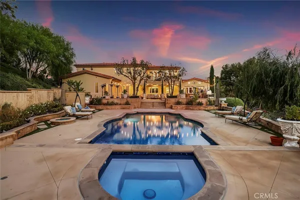 a view of a swimming pool with a lounge chairs