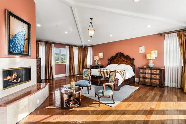 a bed room with a bed and a fireplace