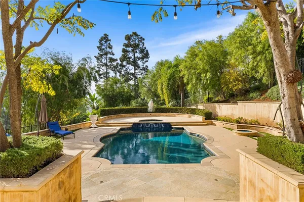 a view of a swimming pool with a patio