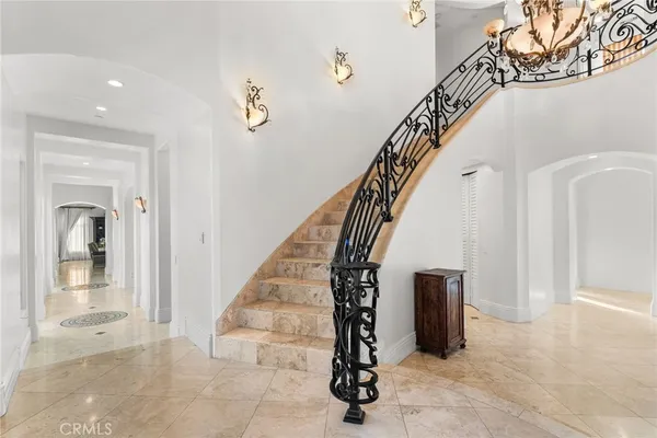 a view of entryway and hall with a front door