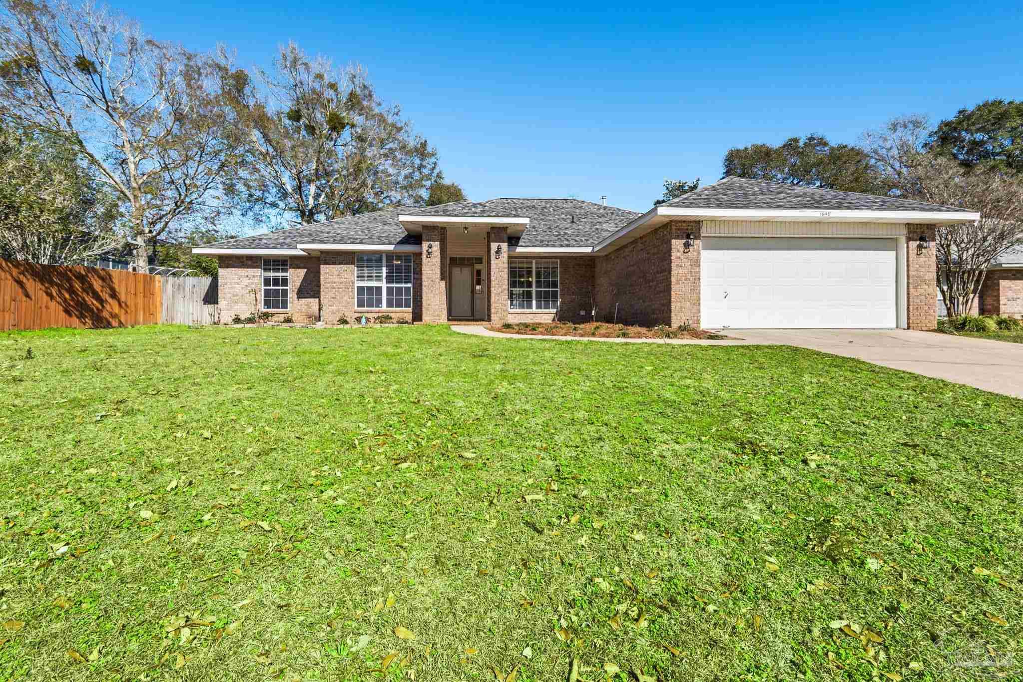front view of a house with a big yard