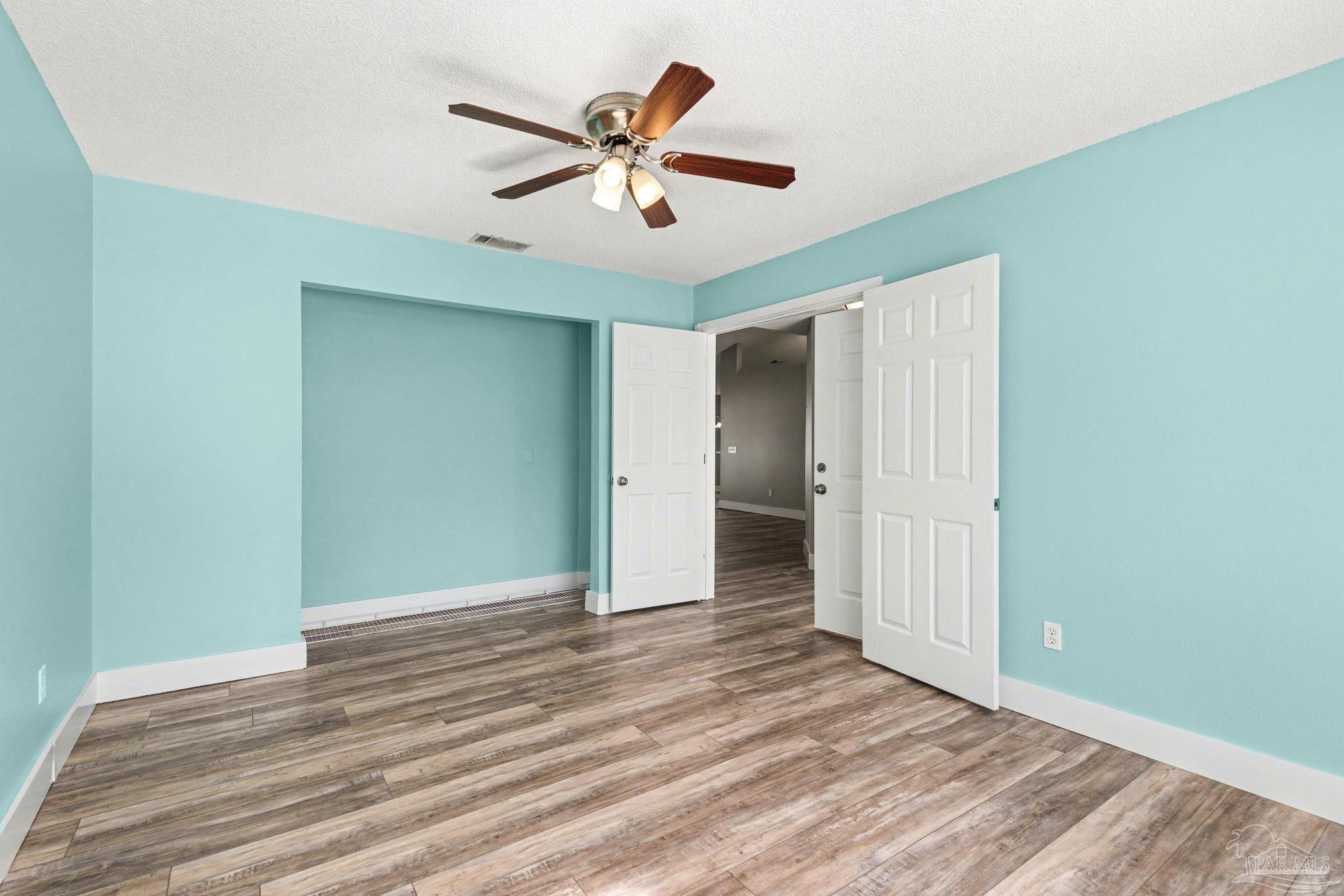 1648 Condor Drive Cantonment, FL 32533 - Photo 14 of 51 a view of empty room with wooden floor