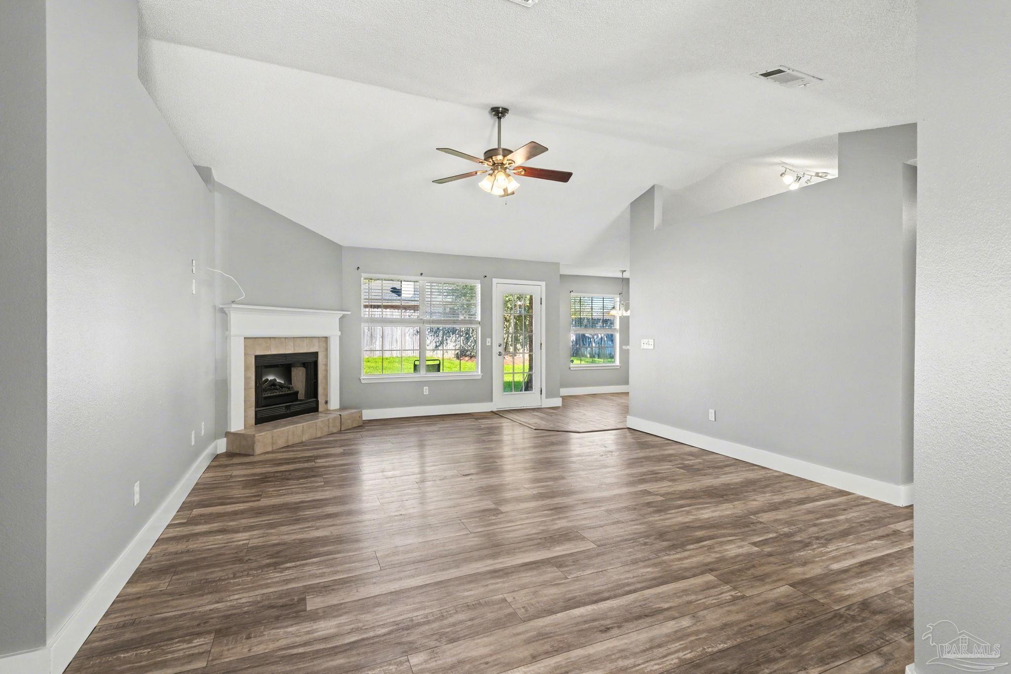 1648 Condor Drive Cantonment, FL 32533 - Photo 17 of 51 wooden floor in an empty room with a window