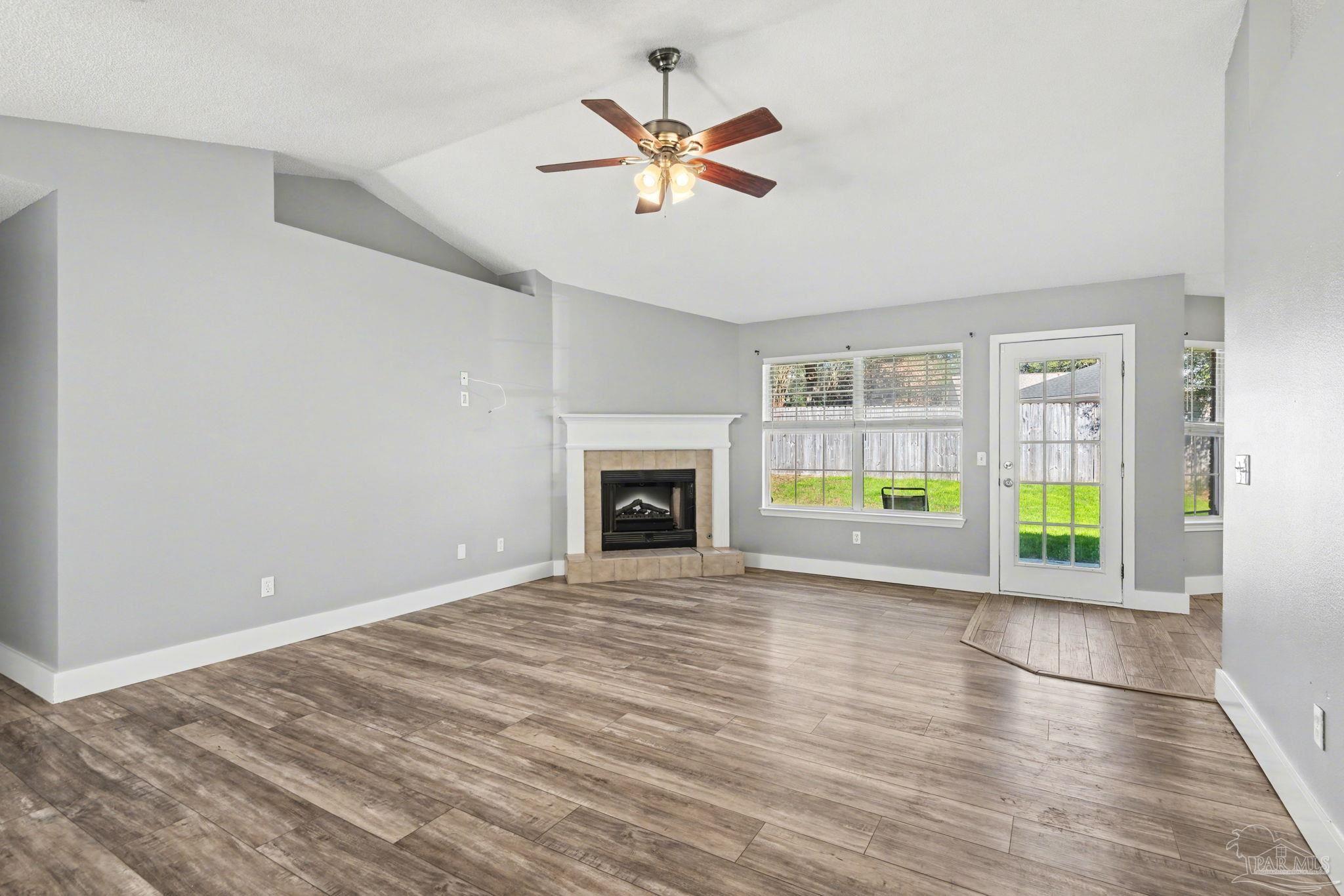 1648 Condor Drive Cantonment, FL 32533 - Photo 18 of 51 a view of an empty room with a window and fireplace