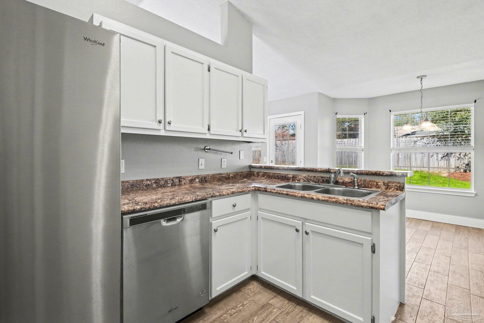 1648 Condor Drive Cantonment, FL 32533 - Photo 21 of 51 a kitchen with cabinets and appliances