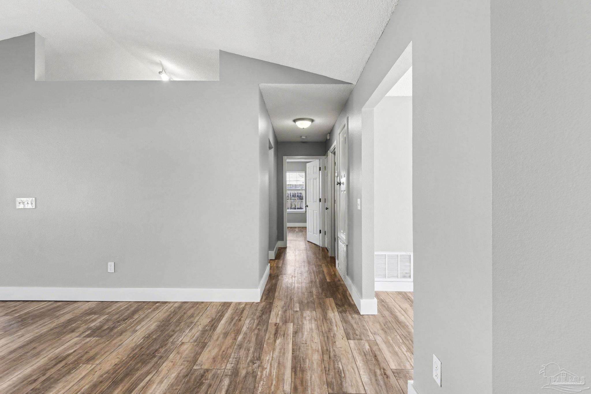 1648 Condor Drive Cantonment, FL 32533 - Photo 26 of 51 a view of a hallway with wooden floor