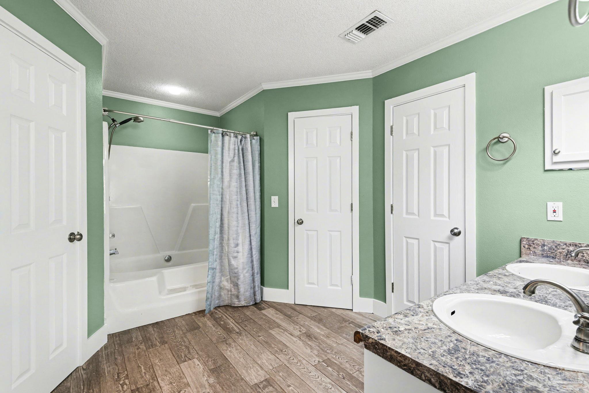 1648 Condor Drive Cantonment, FL 32533 - Photo 30 of 51 a bathroom with a granite countertop tub sink and mirror