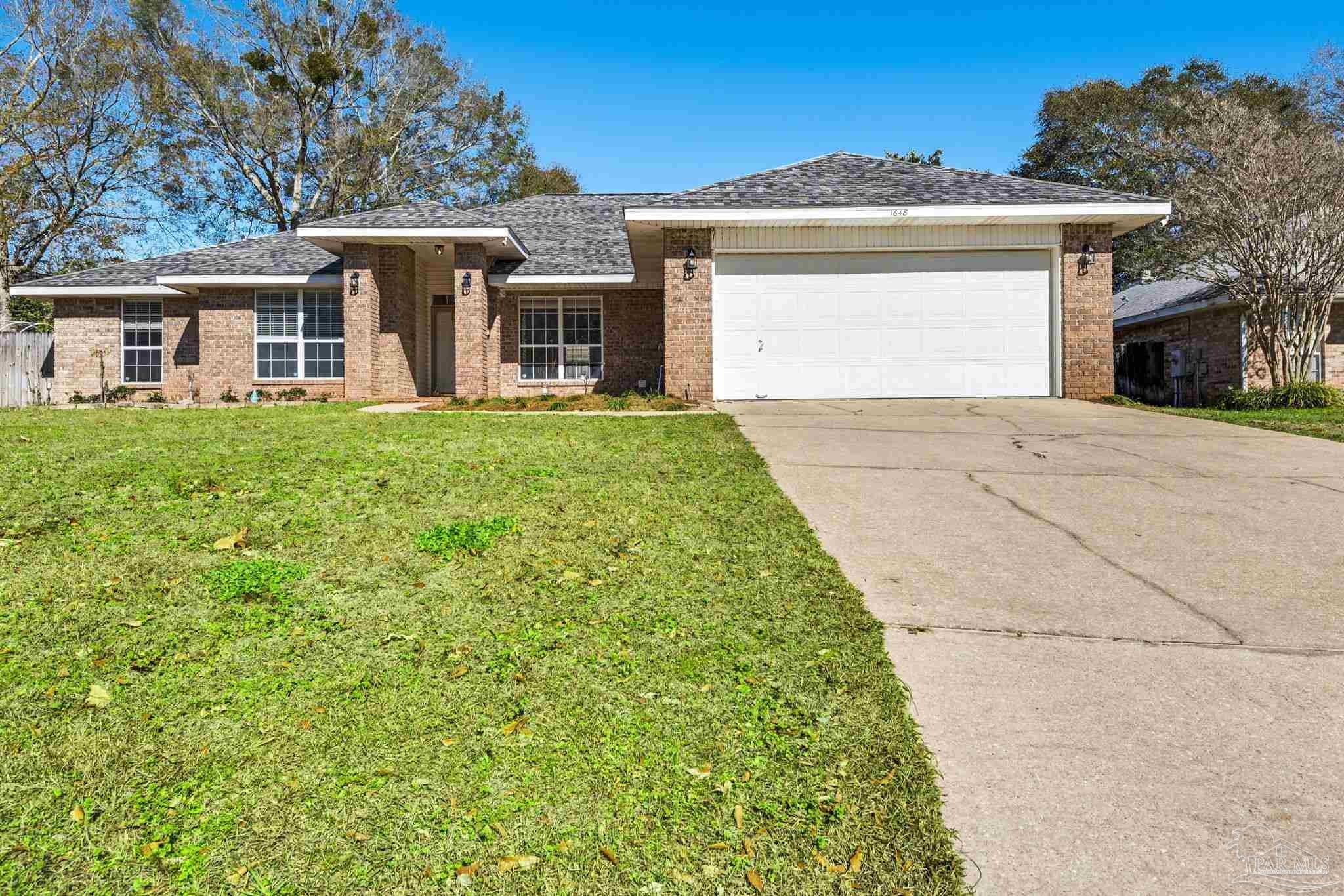 1648 Condor Drive Cantonment, FL 32533 - Photo 3 of 51 front view of a house with a yard