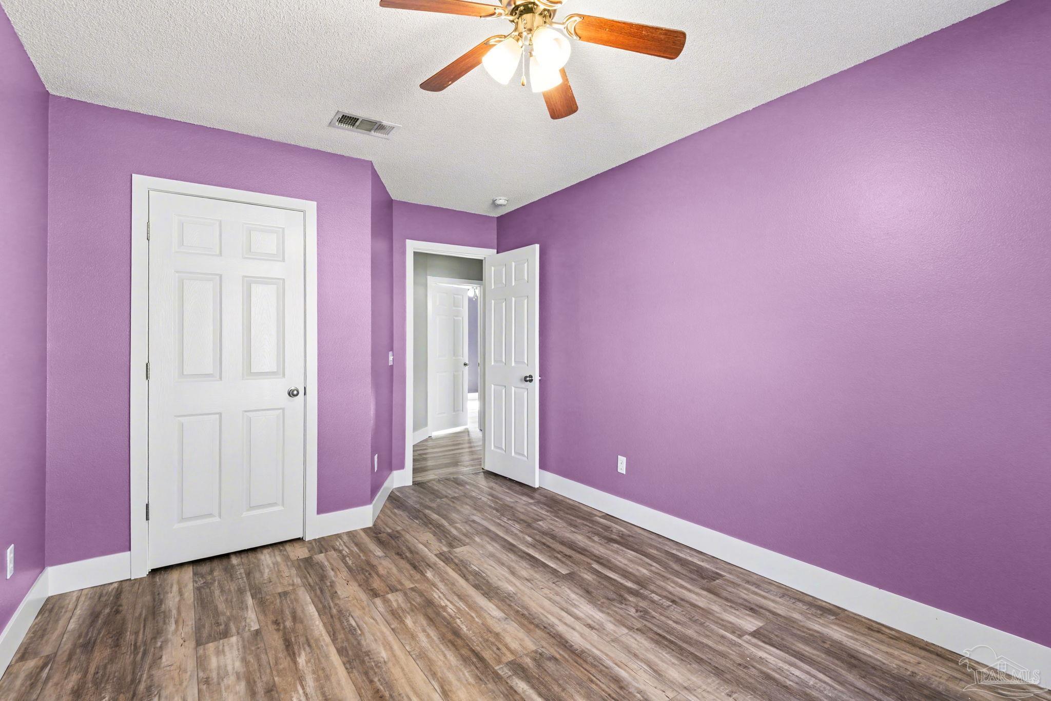 1648 Condor Drive Cantonment, FL 32533 - Photo 37 of 51 a view of empty room with wooden floor and fan