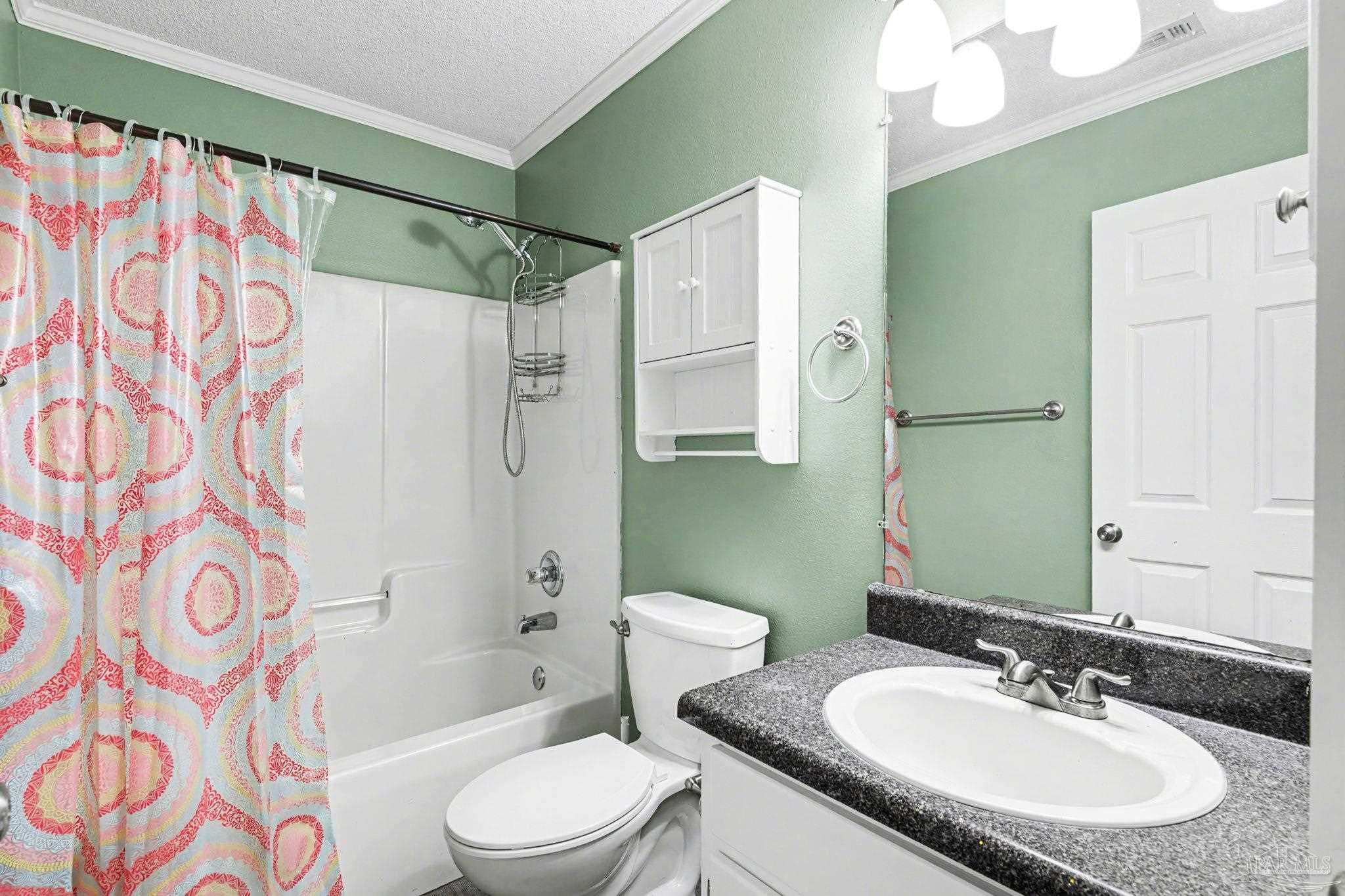 1648 Condor Drive Cantonment, FL 32533 - Photo 40 of 51 a bathroom with a sink toilet and shower