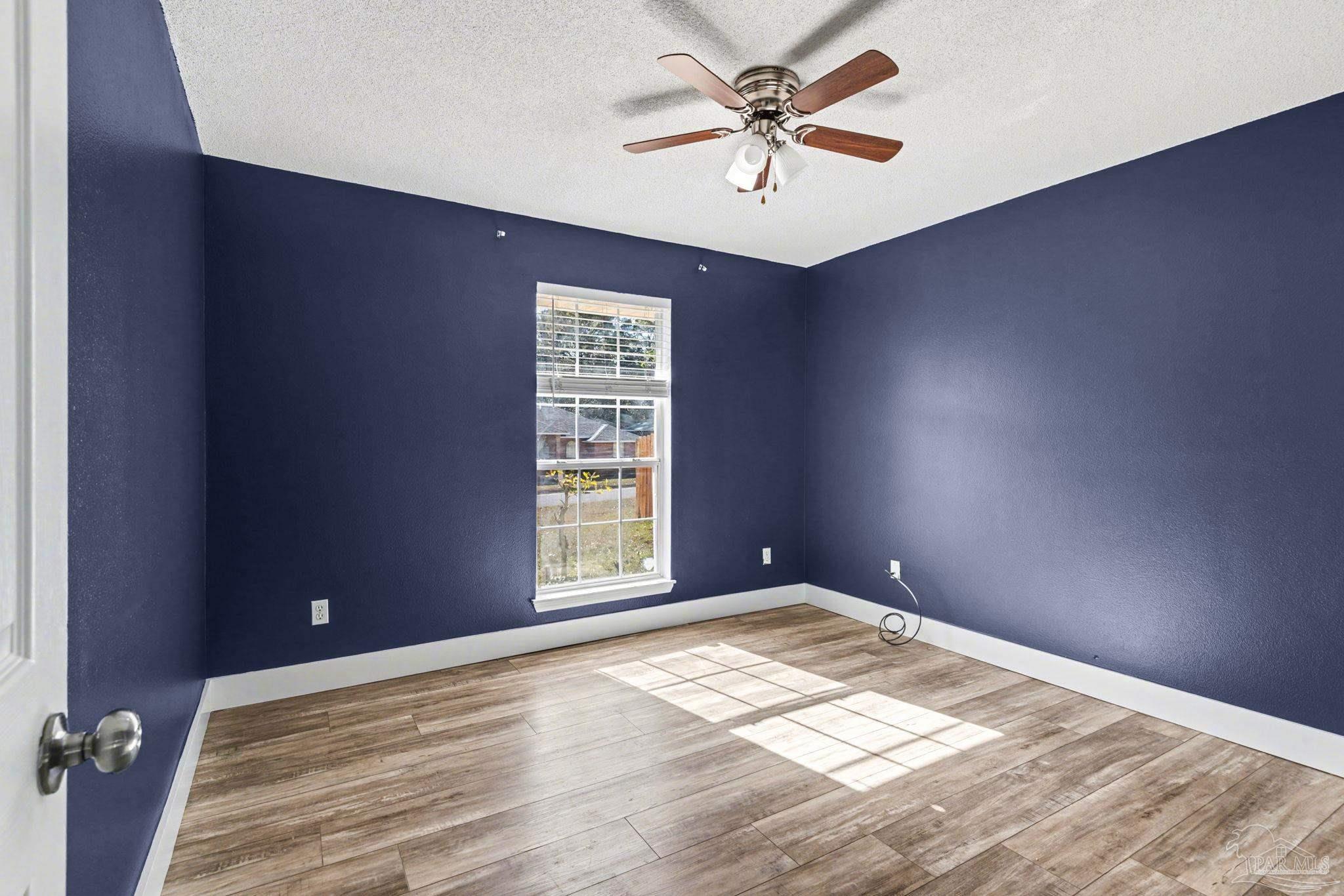 1648 Condor Drive Cantonment, FL 32533 - Photo 41 of 51 an empty room with windows and fan