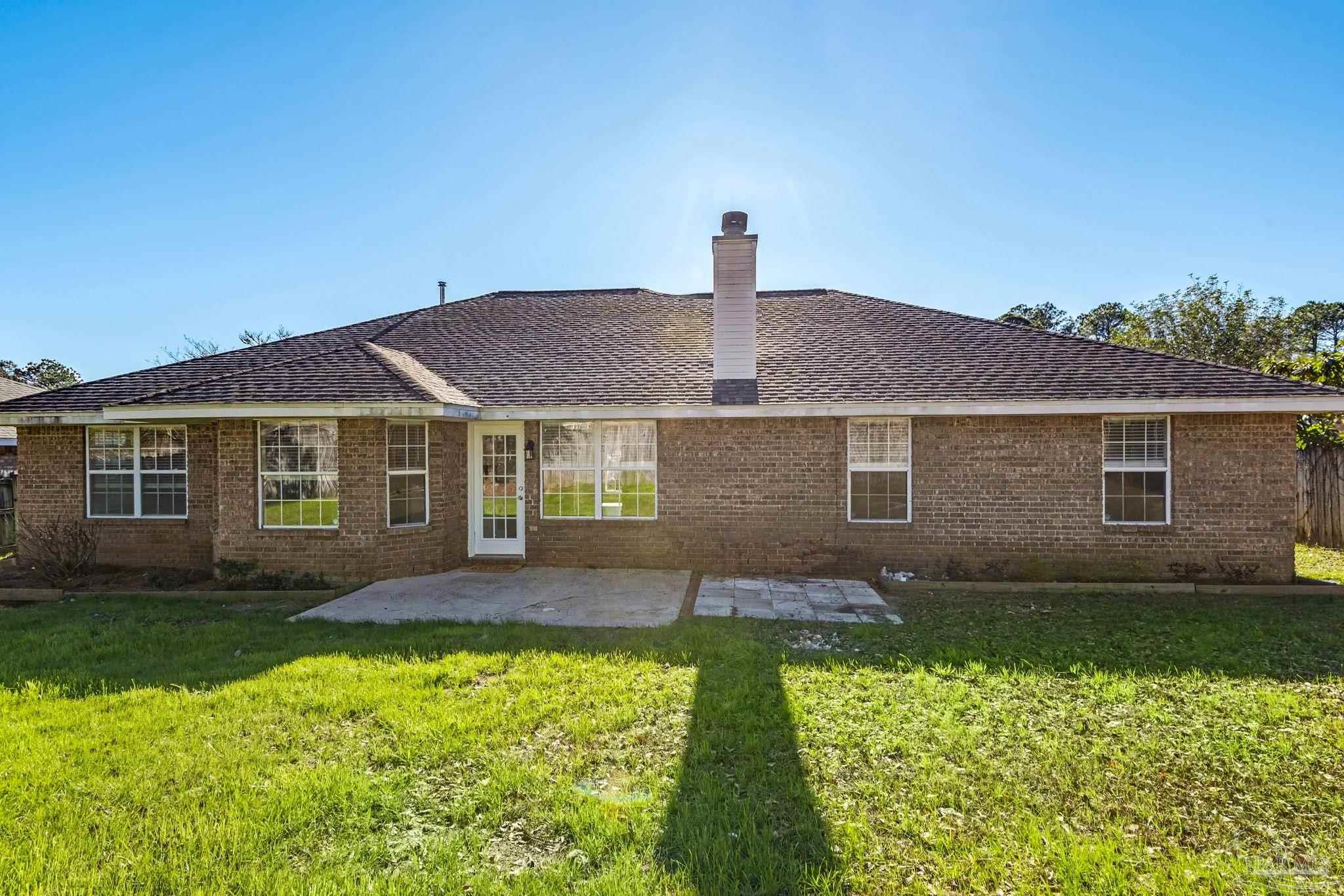 1648 Condor Drive Cantonment, FL 32533 - Photo 47 of 51 a front view of a house with a yard