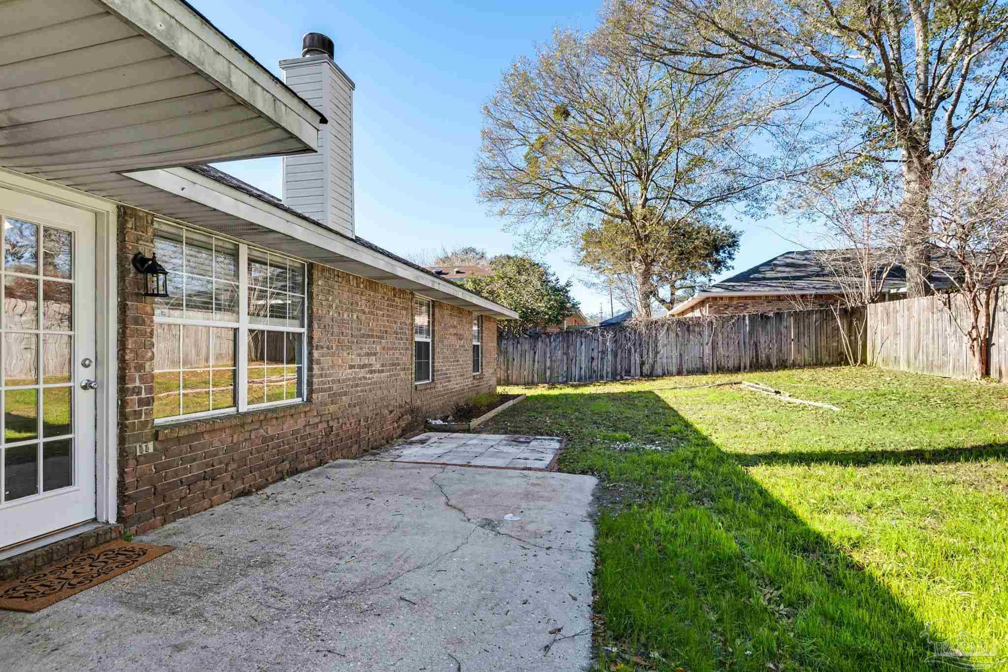 1648 Condor Drive Cantonment, FL 32533 - Photo 49 of 51 a view of a house with backyard and a tree