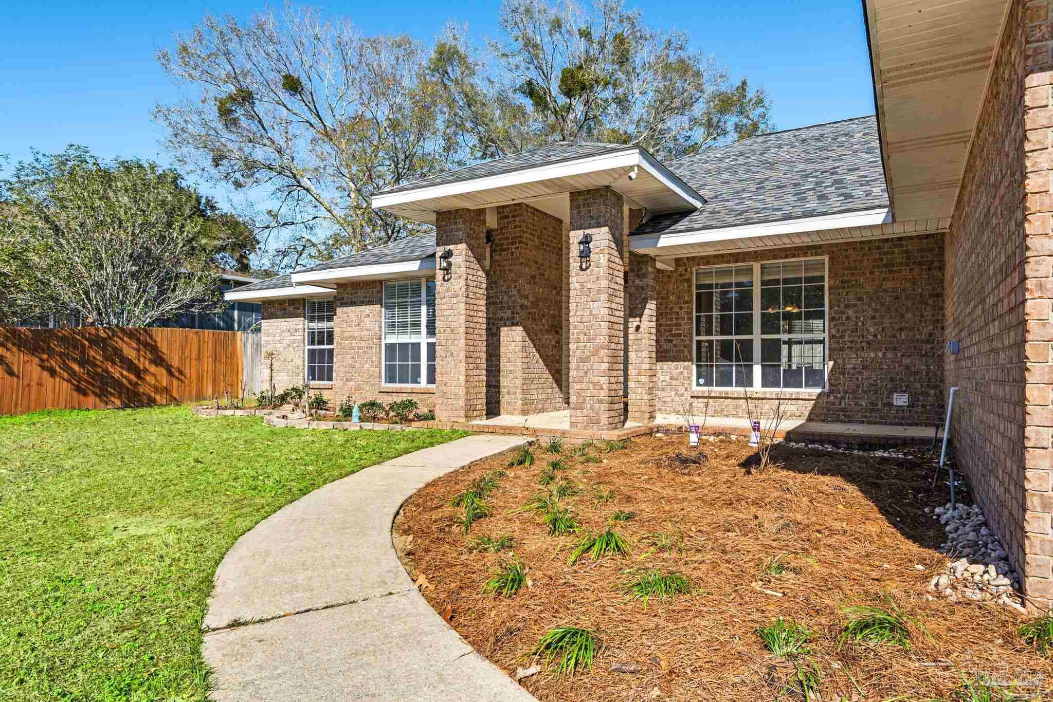1648 Condor Drive Cantonment, FL 32533 - Photo 5 of 51 front view of a house with a porch