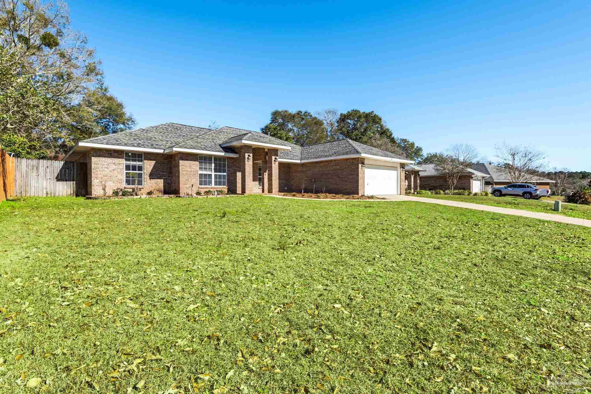 1648 Condor Drive Cantonment, FL 32533 - Photo 6 of 51 a house with a garden