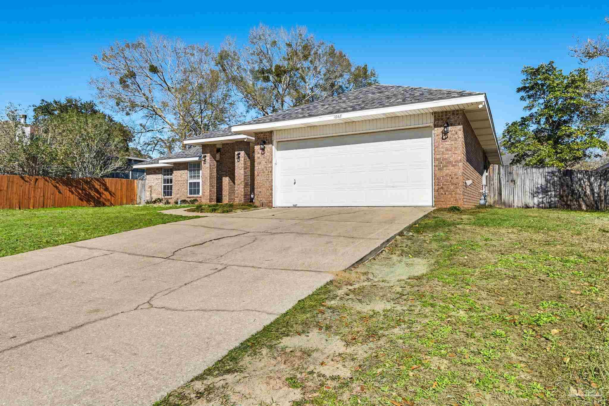 1648 Condor Drive Cantonment, FL 32533 - Photo 7 of 51 a view of a house with a yard