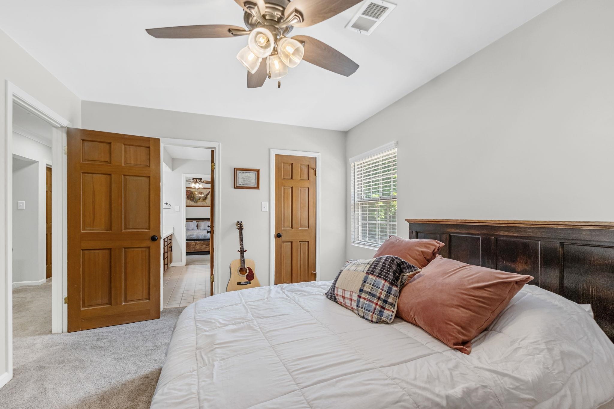 4729 Cedar Ridge Drive Millington, TN 38053 - Photo 29 of 40 Carpeted room with a ceiling fan, a window with blinds, and two wood-paneled doors