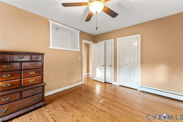 a view of a livingroom with wooden floor and closet
