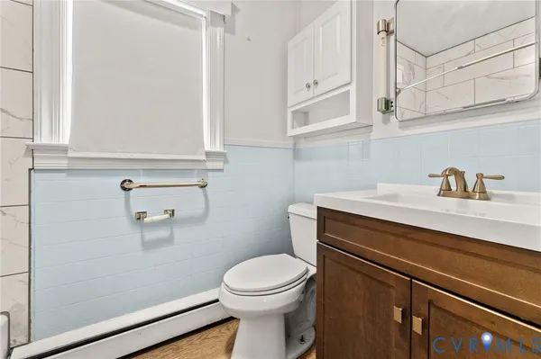 a bathroom with a sink a toilet and vanity