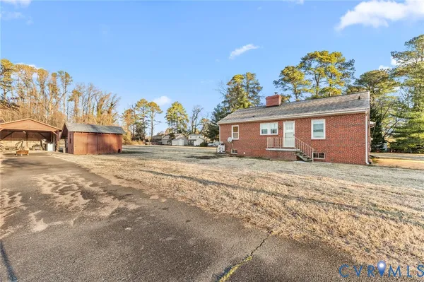 a front view of a house with a yard and a garage
