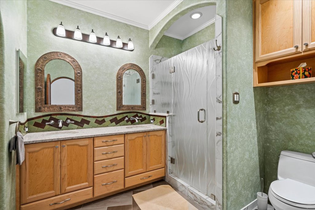 37 Pillow Road Austin, TX 78745 - Photo 10 of 18 Granite counters and dual vanities elevate this well-appointed bathroom.