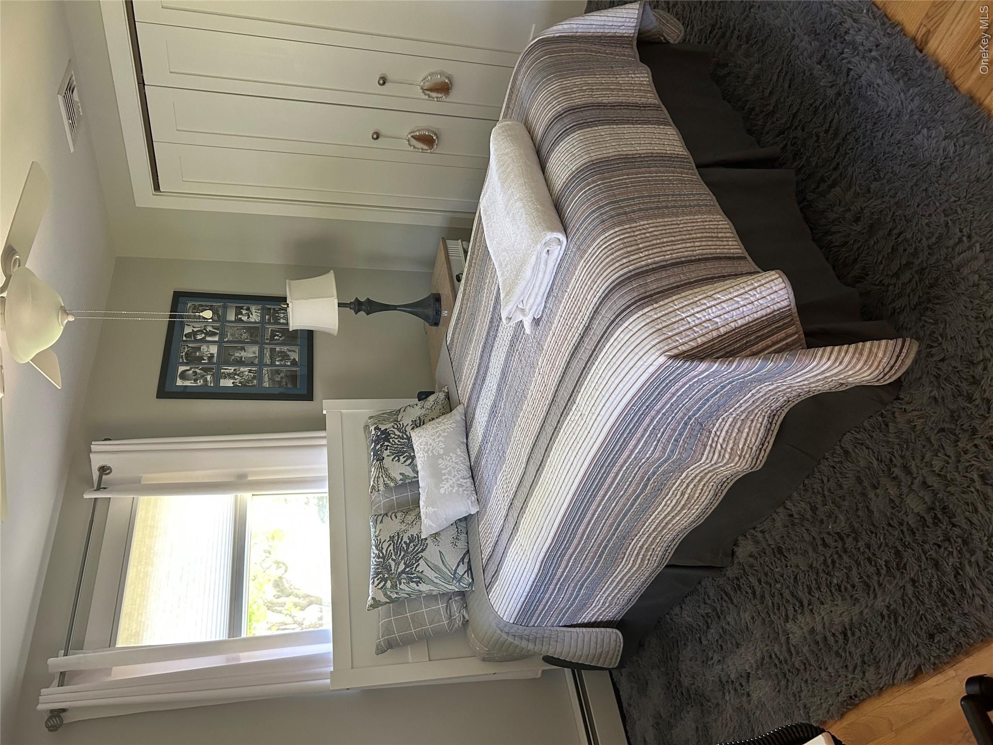 58 Wheaton Avenue Fishkill, NY 12524 - Photo 11 of 20 a bedroom with a bed and a window