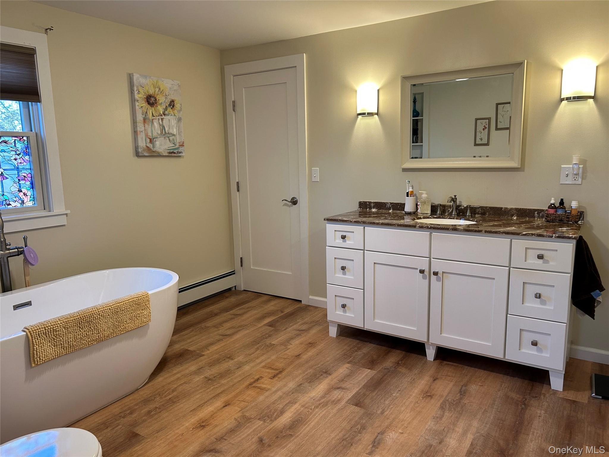 58 Wheaton Avenue Fishkill, NY 12524 - Photo 13 of 20 a spacious bathroom with a double vanity sink and a mirror