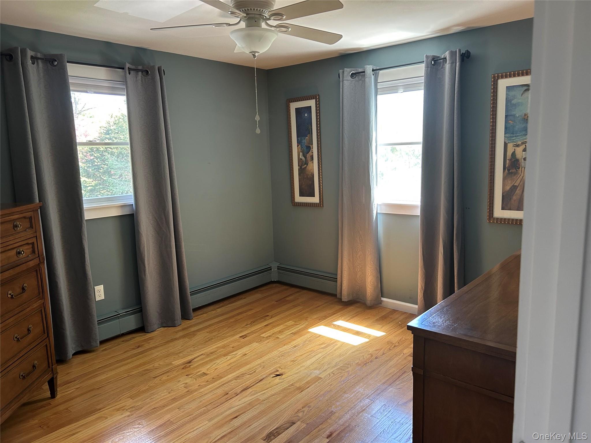 58 Wheaton Avenue Fishkill, NY 12524 - Photo 17 of 20 an empty room with wooden floor and windows
